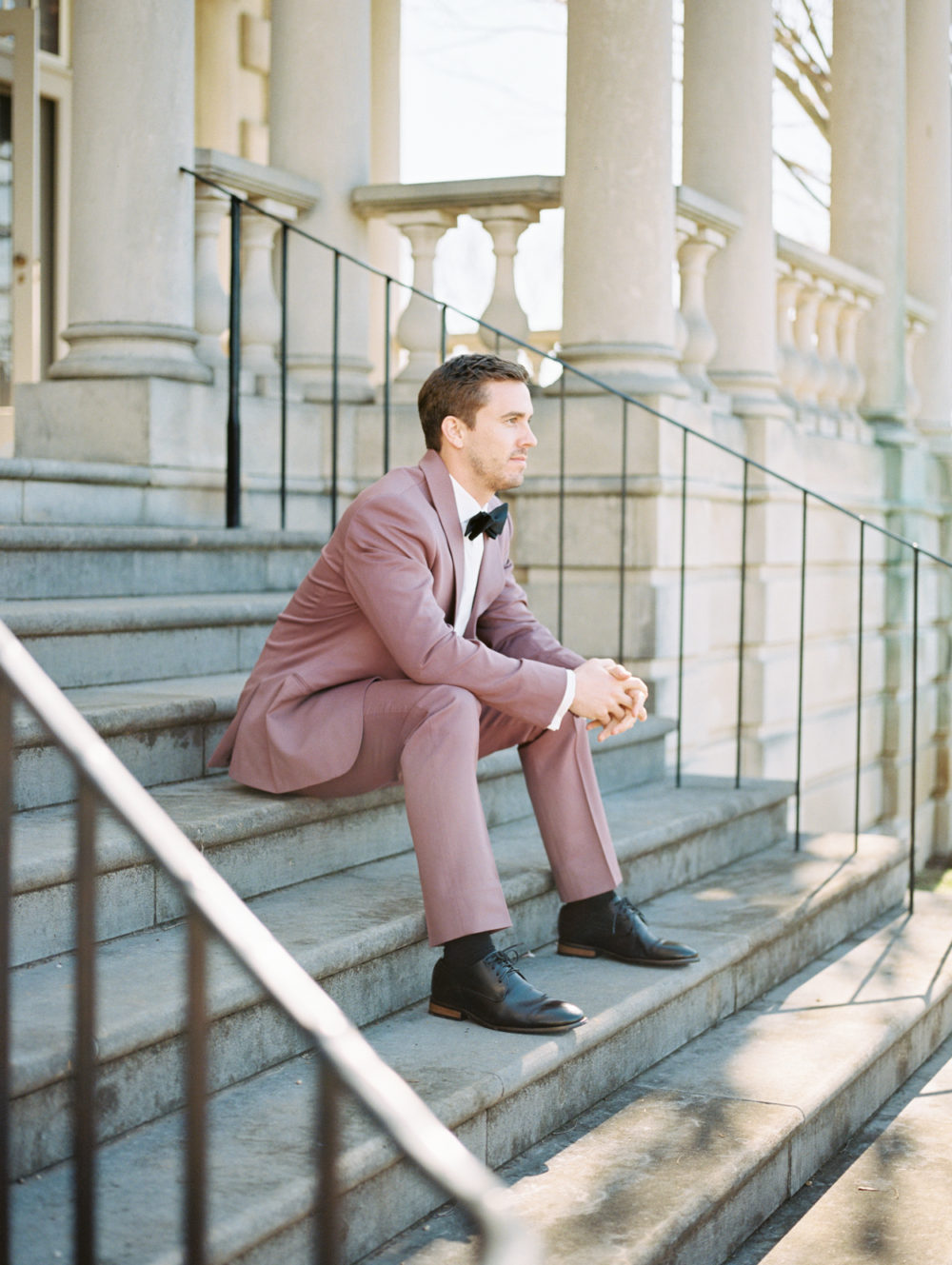Burgundy groom's suit for wedding day at Great Marsh Estate 