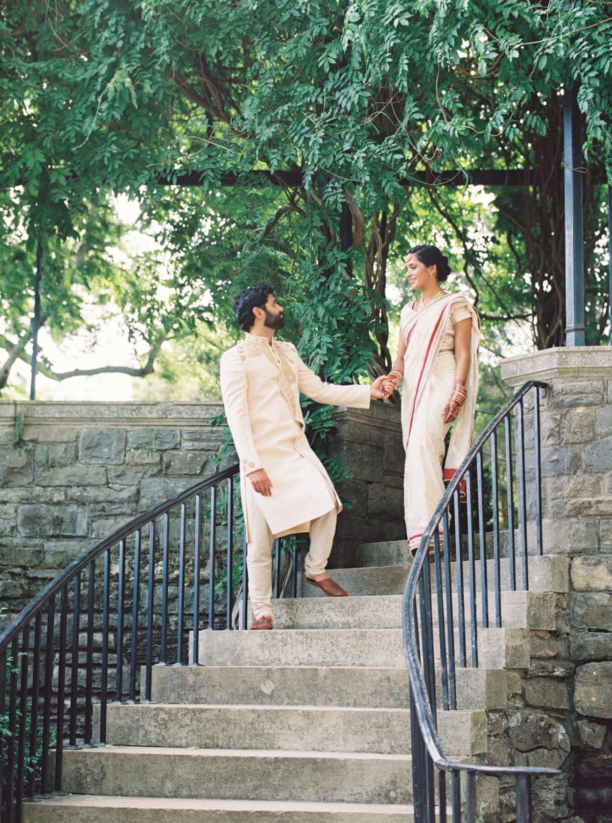 Couple walks down staircase at Cheekwood wedding
