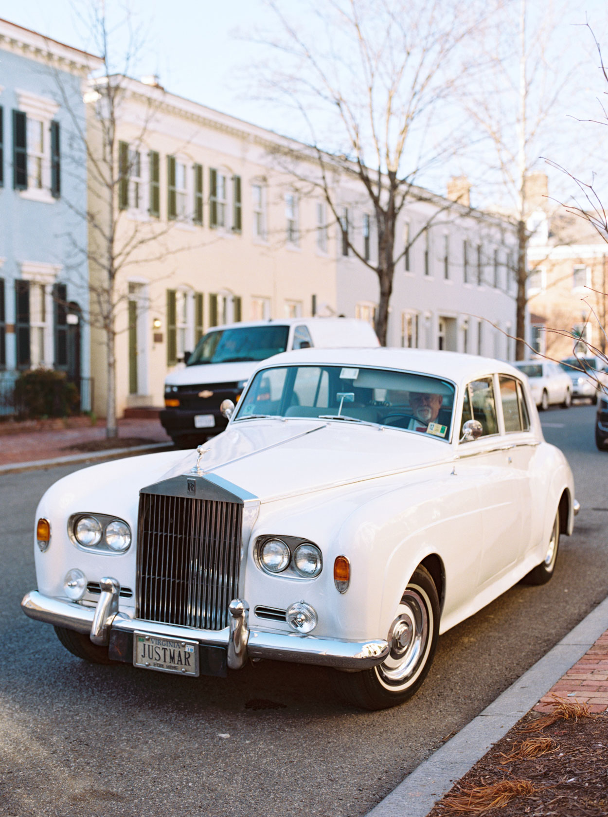 Classic Rolls Royce awaits to pick up bride and groom in Georgetown after marriage ceremony