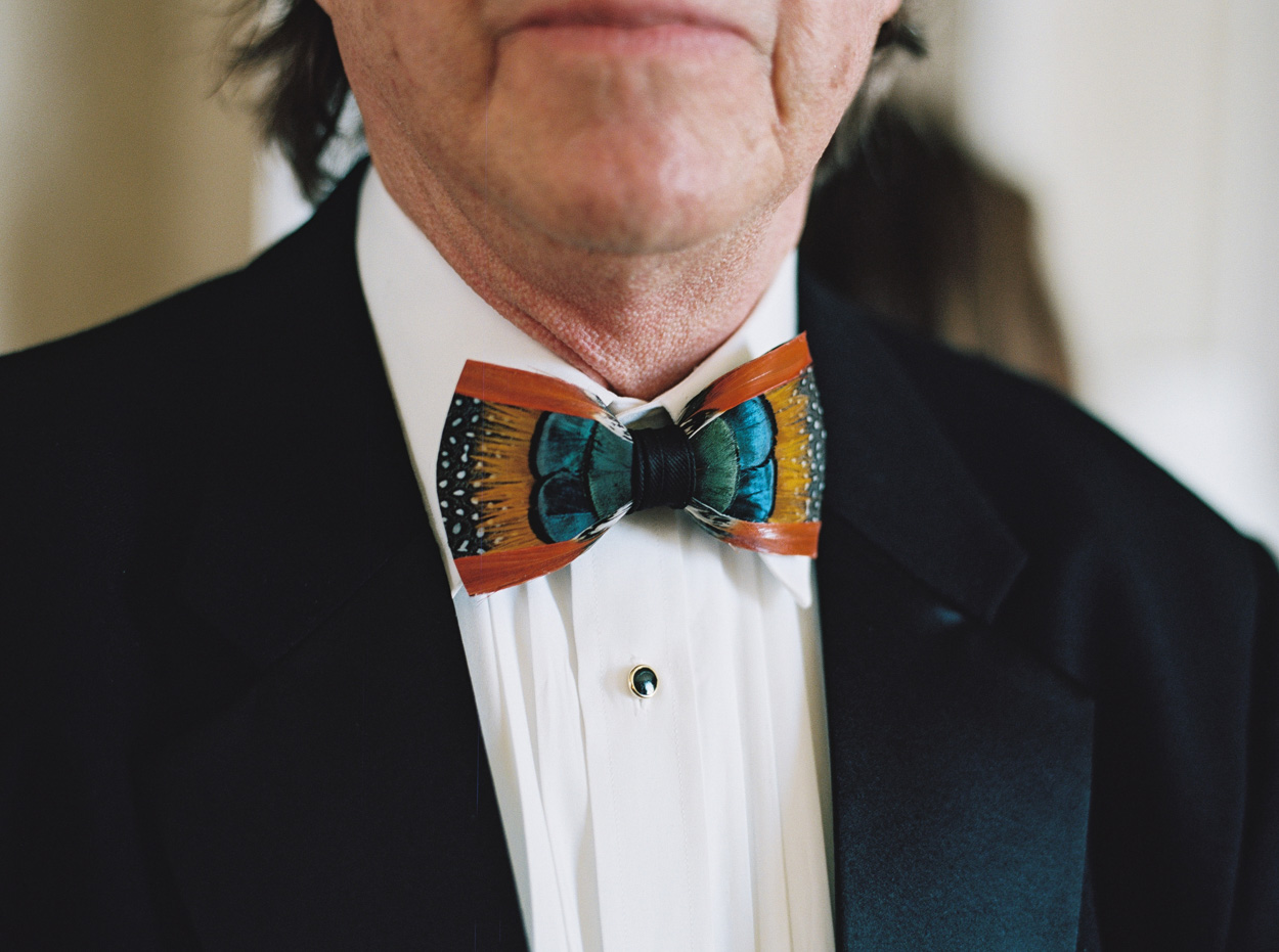 Father of the Bride wear a fun feather neck tie for daughter's wedding