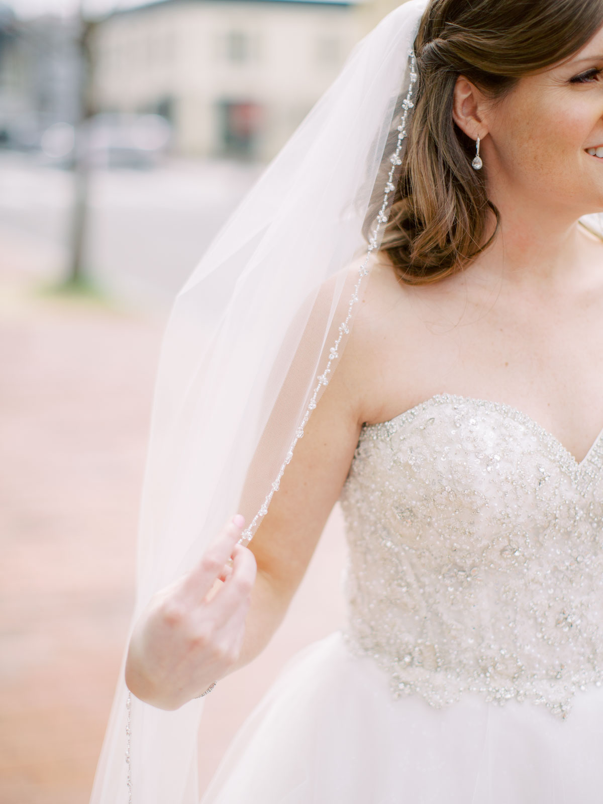 Close up of beaded fingertip wedding veil