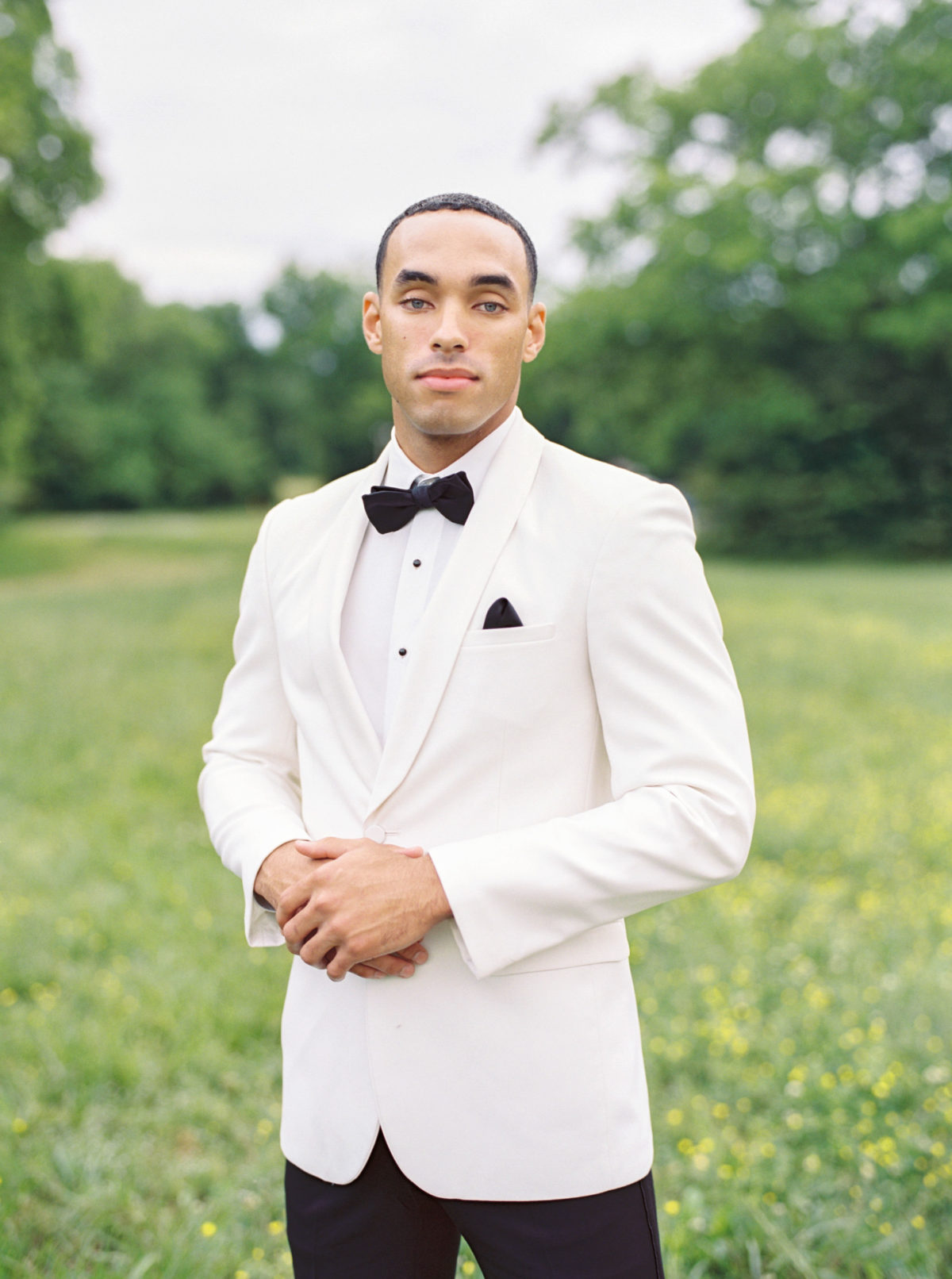 Classic white groom's tuxedo by Street Tuxedo for Green Door Gourmet wedding in Nashville.