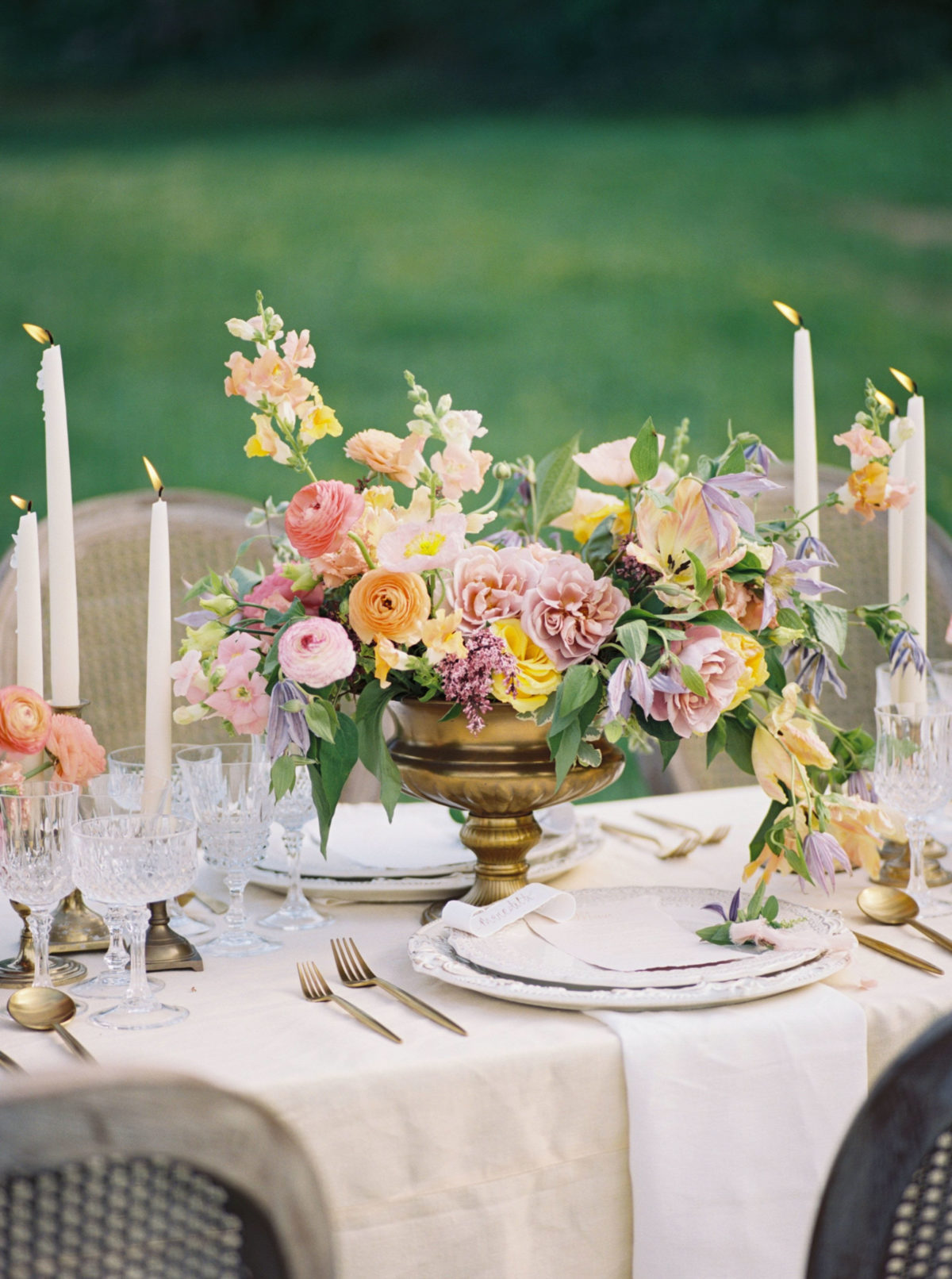 Colorful and loose wedding reception centerpiece by Vintage Florals in Nashville.