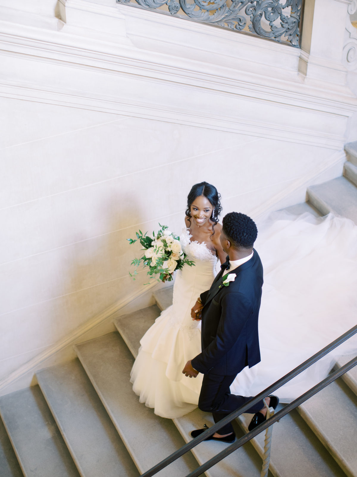 Wedding couple poses for portraits and Anderson House in DC.