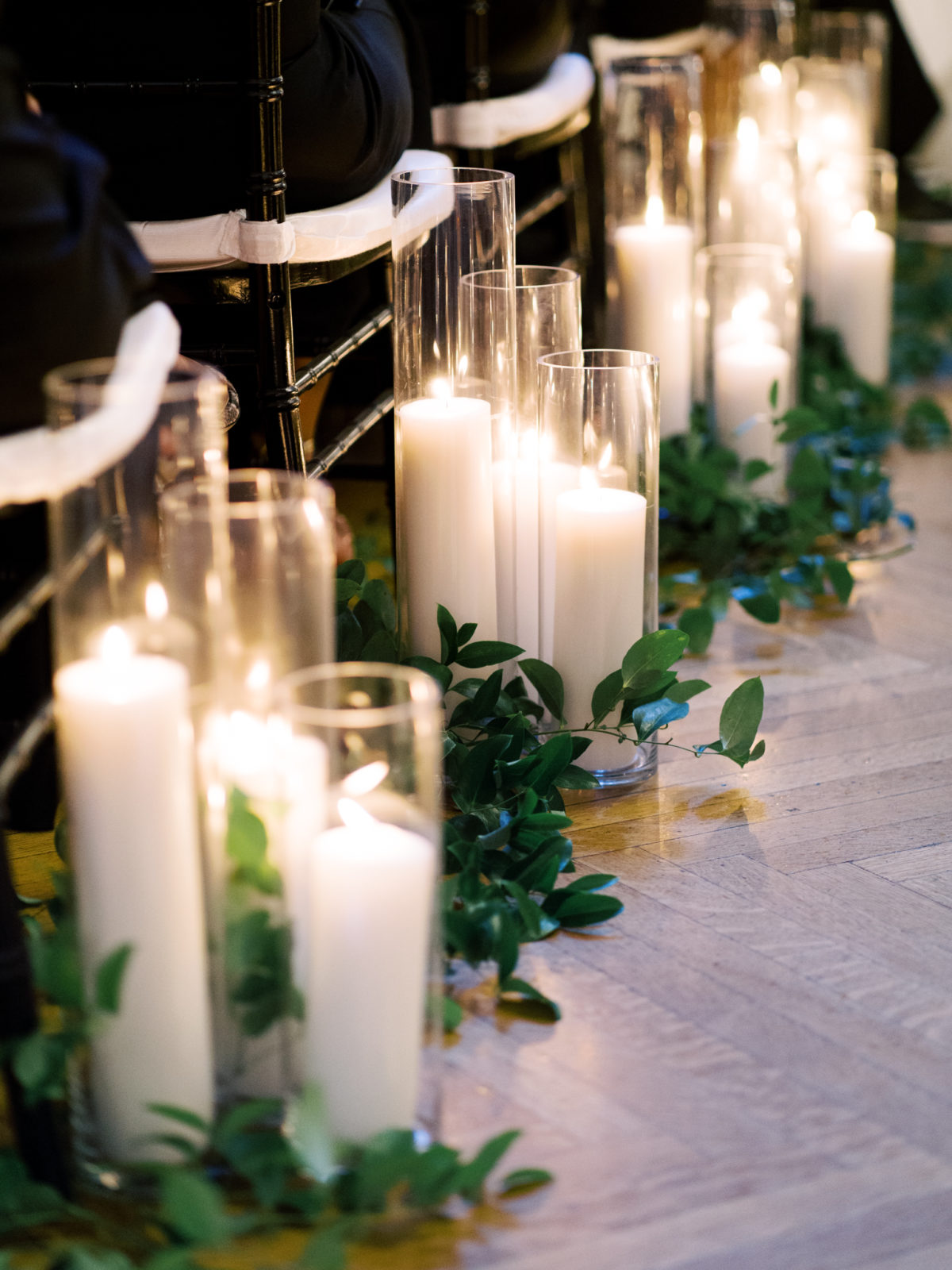 Romantic candles lining the aisle at Anderson House wedding ceremony.