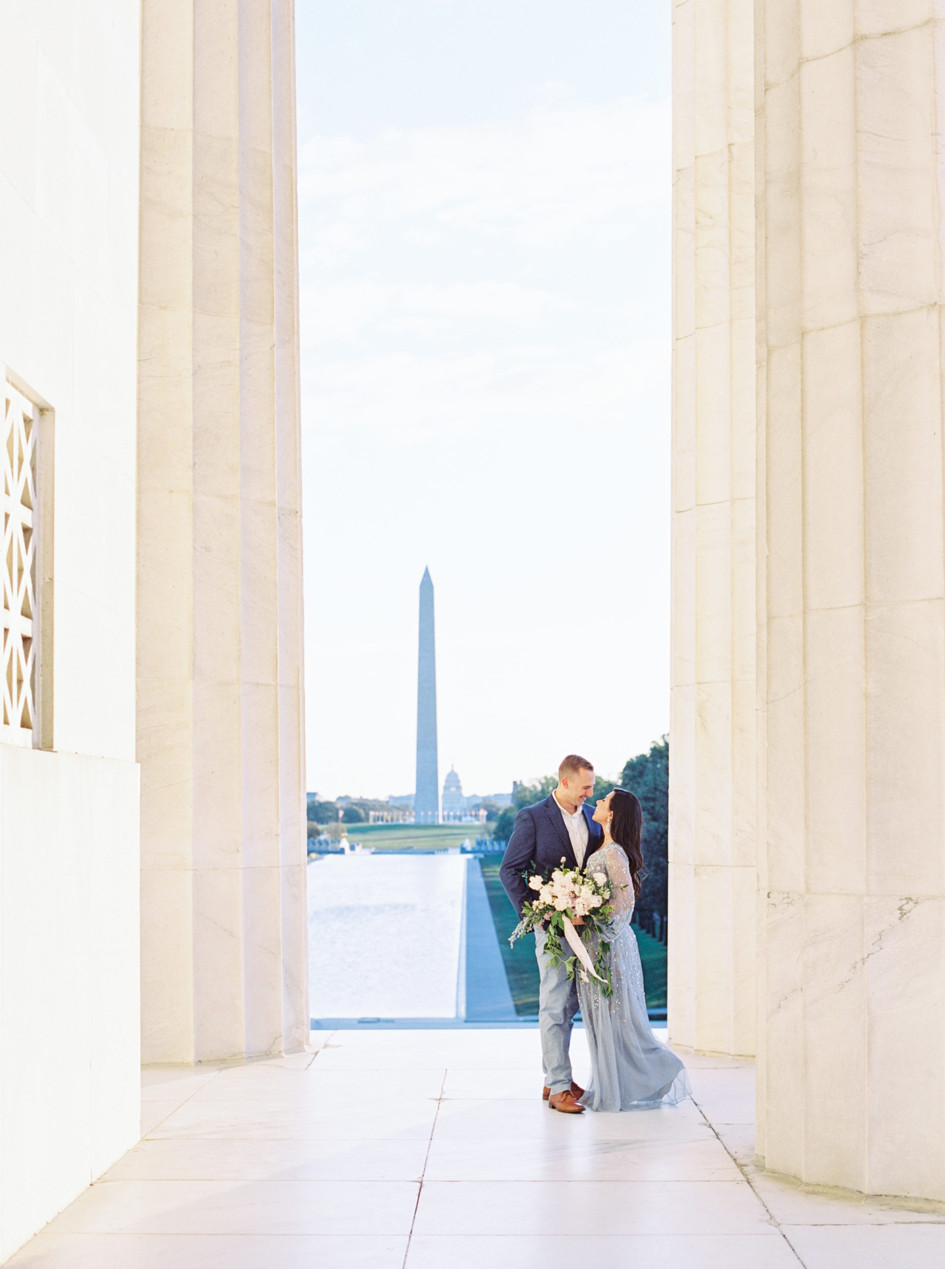 Classic Lincoln Memorial engagement session inside the iconic white pillars
