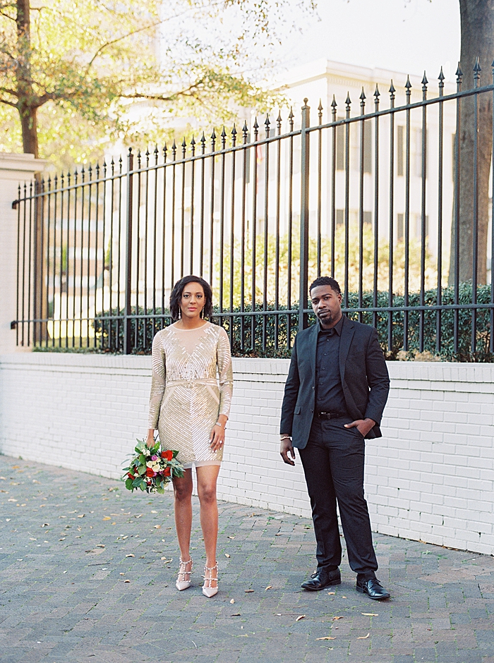 Chic downtown Jackson engagement featuring a red roses winter bouquet.
